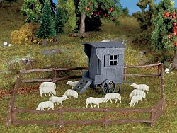 Pastýřův vozík a stádo ovcí